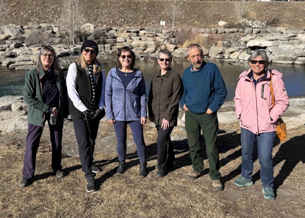 6 people standing by river